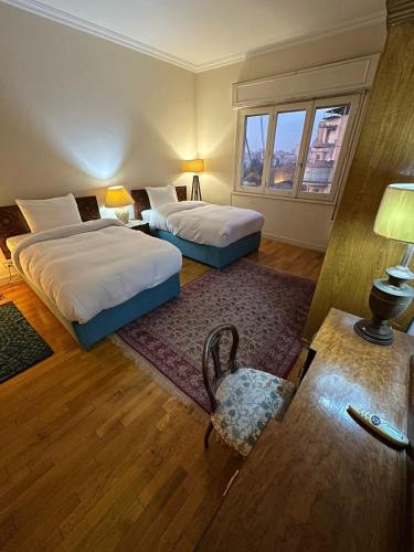 Postel nebo postele na pokoji v ubytování Royal Nile view 2BR