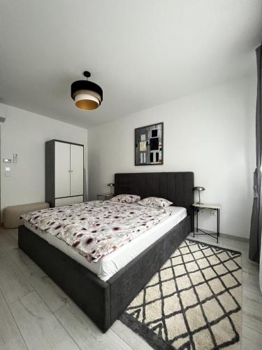 a bedroom with a large bed in a room at MT Suites ApartHotel in Budapest