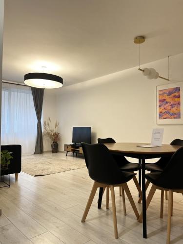 a dining room with a table and chairs at MT Suites ApartHotel in Budapest