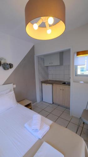 Postel nebo postele na pokoji v ubytování Cocoon Hotel-Beach bar