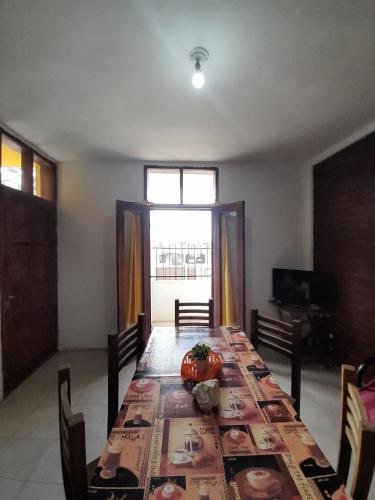 a dining room with a table with a pumpkin on it at Complejo Don Tito in San Juan