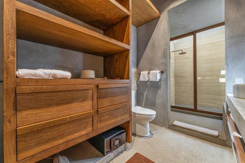 a bathroom with a toilet and a sink at Salara in Todos Santos