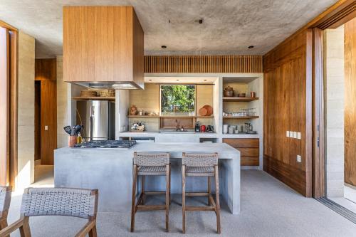 a kitchen with a large island in the middle at Salara in Todos Santos