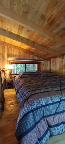 Postel nebo postele na pokoji v ubytování Cabaña Arrayan