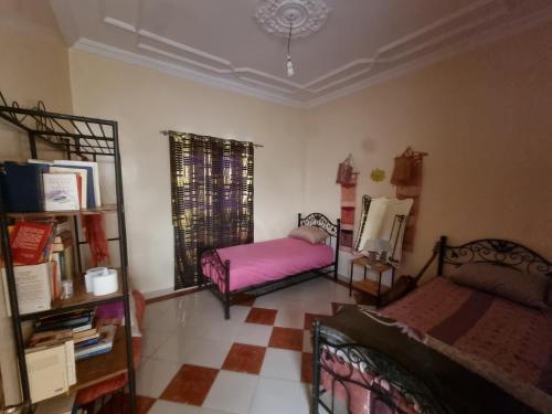 Ένα ή περισσότερα κρεβάτια σε δωμάτιο στο Appartement du Fleurs