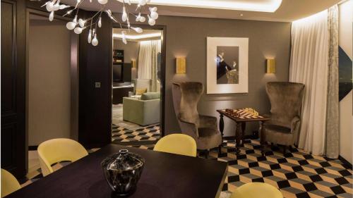 a dining room with a table and chairs at Hilton Amsterdam Airport Schiphol in Schiphol