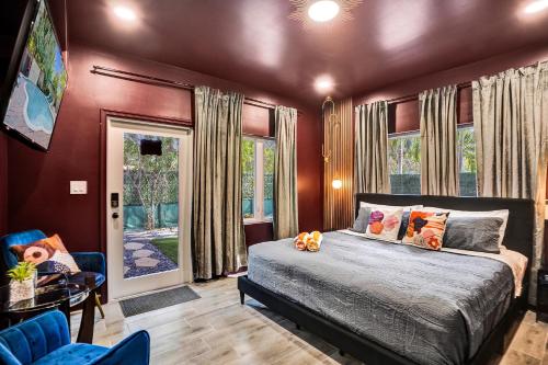 a bedroom with a bed and a window at Kiki 5 - Men's Clothing optional Guest Houses in Fort Lauderdale