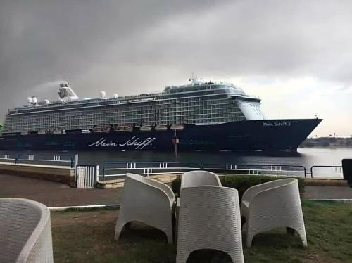 a large cruise ship is docked in the water at The stunning of Ismailia's House in Ismailia