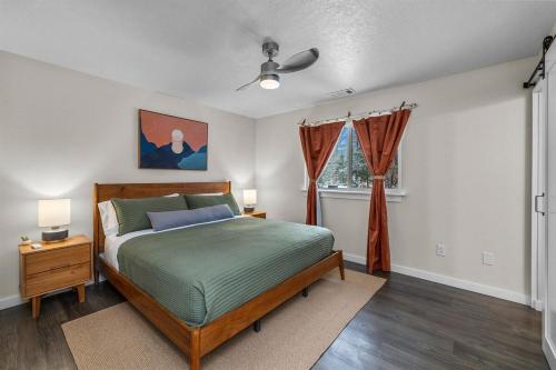 a bedroom with a bed and a window at Hot Tub, Fire Pit, Dog Friendly, Heart of Sisters, Amenities in Sisters