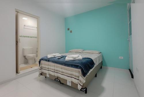 Katil atau katil-katil dalam bilik di Suites Praia de Juquehy