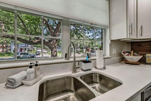 a kitchen counter with a sink and windows at Elegant Mansion on Park in Historic Avondale in Jacksonville