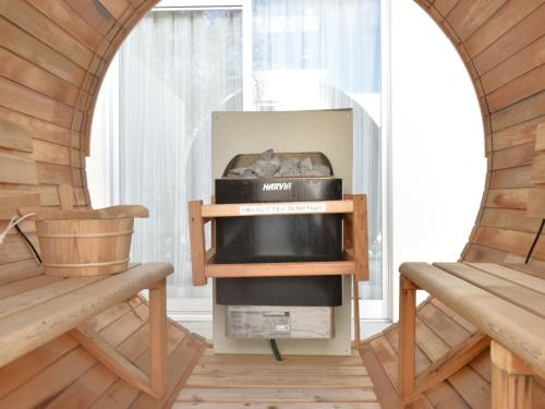 a living room with an arched window and a fireplace at The Pool & Sauna Villa MOTOBU in Motobu