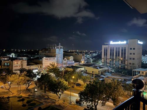 a view of a city at night with buildings at Ho Phong Hotel in Phan Rang