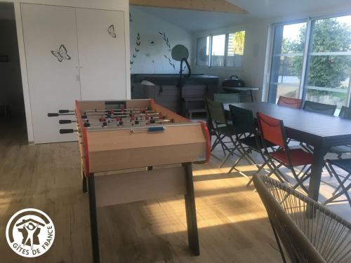 a living room with a table and a chess board at Maison spacieuse avec spa et sauna, proche centre-ville, plages et sites touristiques de Vendée - FR-1-426-558 in La Roche-sur-Yon
