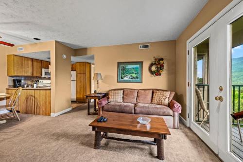 a living room with a couch and a table at Rocky Top Oasis in Gatlinburg
