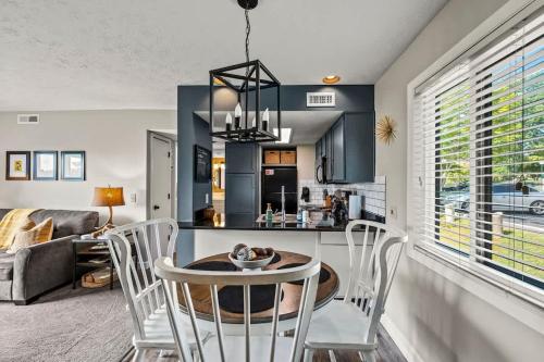 a kitchen and living room with a table and chairs at Point of View in Gatlinburg