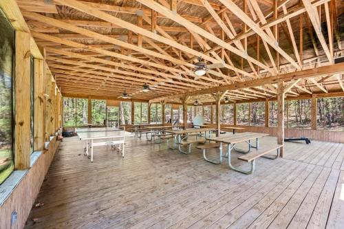 a large pavilion with tables and benches on a wooden floor at Point of View in Gatlinburg