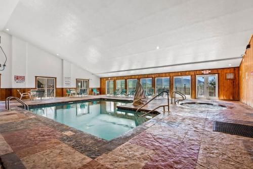 a large swimming pool in a large room with at Diamond On The Ridge in Gatlinburg