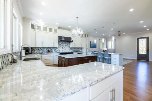 a large kitchen with a large marble counter top at Heaven's Summit in Gatlinburg
