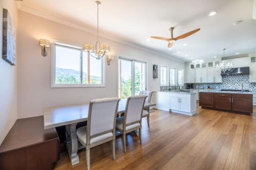 a dining room and kitchen with a table and chairs at Heaven's Summit in Gatlinburg