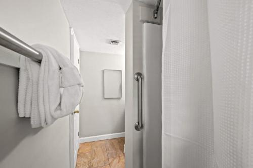 a bathroom with a shower with a towel on a door at Smoky Ridge Retreat in Gatlinburg