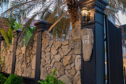 a stone wall with a light on top of it at Villa Candle In The Wind - Gần Bãi Sau Vũng Tàu in Vung Tau