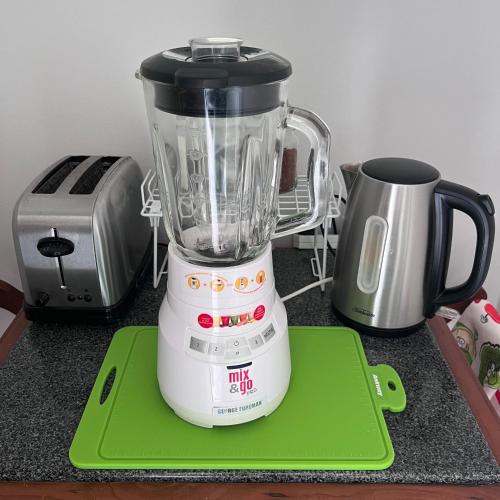 a blender sitting on top of a counter at Kitchen Garden Studio Bed and Breakfast in Auckland