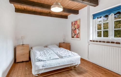 a white bedroom with a bed and a window at Gorgeous Home In Ulfborg With Sauna in Ulfborg