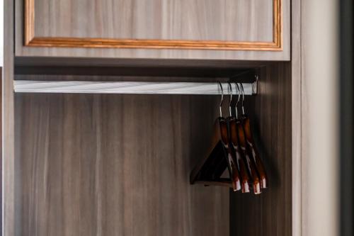 a closet with a bunch of wooden utensils at Dream Mansion Hotel in Taichung