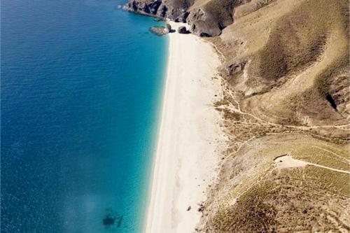 an aerial view of a beach next to the ocean at Comfortable Apartment in Almería with Shared Pool - 72 m² in Retamar