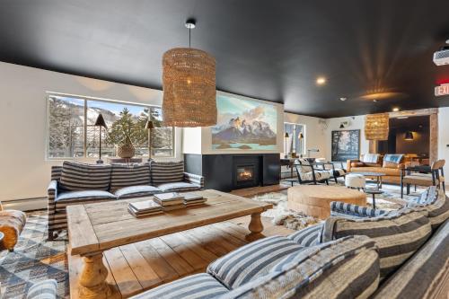 a living room with couches and a table at Inn At Mount Snow in West Dover