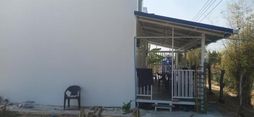 a small building with a roof on top of it at VicaWorld in Prathai