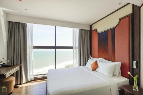 Postel nebo postele na pokoji v ubytování Apec Beach Mui Ne Resort