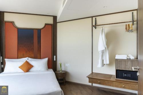 Postel nebo postele na pokoji v ubytování Apec Beach Mui Ne Resort