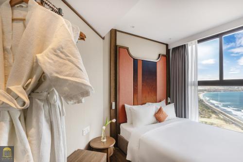 Postel nebo postele na pokoji v ubytování Apec Beach Mui Ne Resort
