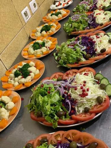 a bunch of plates of food on a table at Hotel Villa Stone Dream Bar Restaurant in Pogradec