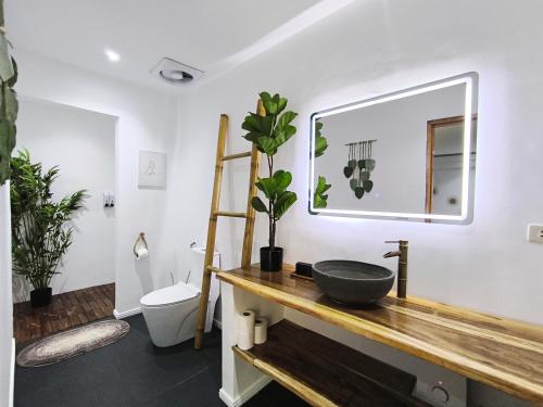 a bathroom with a sink and a mirror at U Story Resort in Siquijor