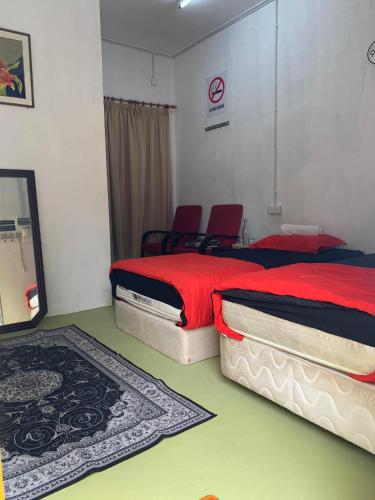 Postel nebo postele na pokoji v ubytování One Mek Bilik Twin