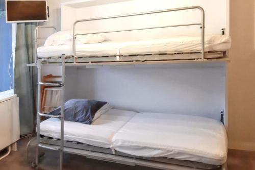 Postel nebo postele na pokoji v ubytování Studio cosy avec balcon et vue sur la montagne à Chamrousse - 19 m²