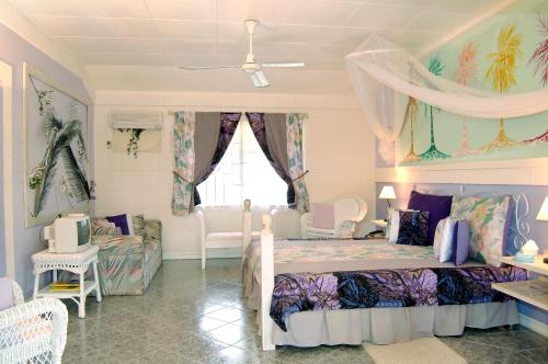a childs bedroom with a bed and a couch at The Legend Garden Condos in Saint Peter