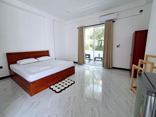 Giường trong phòng chung tại Fortress Holiday Apartments