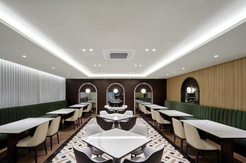a dining room with tables and chairs at Hotel The Botanik Sewoon Myeongdong in Seoul