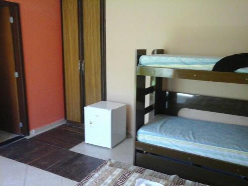 Ein Bett oder Betten in einem Zimmer der Unterkunft Pousada Paradise
