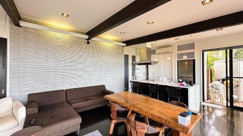 a living room with a couch and a table at 天空サウナ空海 in Kumamoto