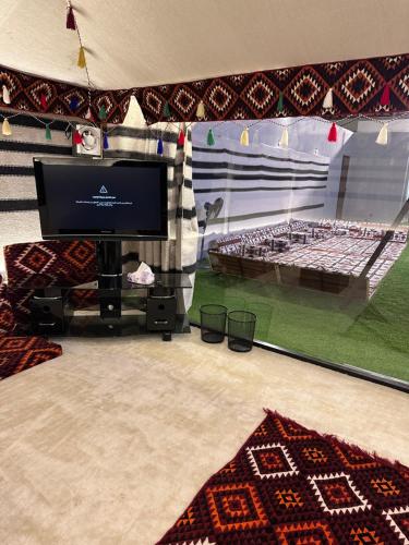 Postel nebo postele na pokoji v ubytování مخيم الفيصل ابحر