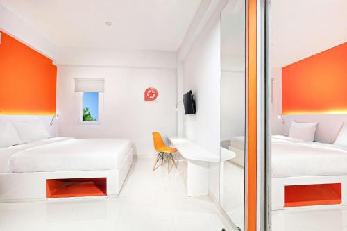 Voodi või voodid majutusasutuse Starlet Hotel Serpong toas
