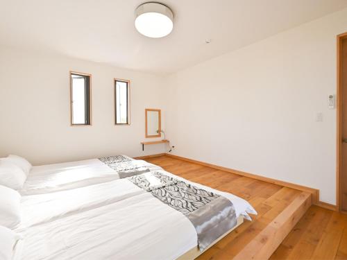 Katil atau katil-katil dalam bilik di 石垣島 villa 7716
