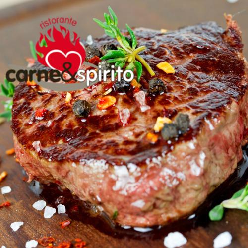 a piece of meat on a table with a sign that reads cancer solutions at Villa Noce in Brescia