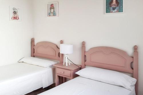Postel nebo postele na pokoji v ubytování Cozy apartment in Santiago del Teide 70 m² mountain view