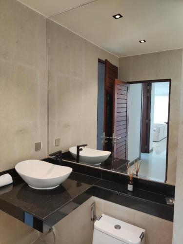 a bathroom with two sinks and a mirror at Luxury 3 BDR Jungle Villa - Infinity Pool & Seaview in Amphoe Koh Samui